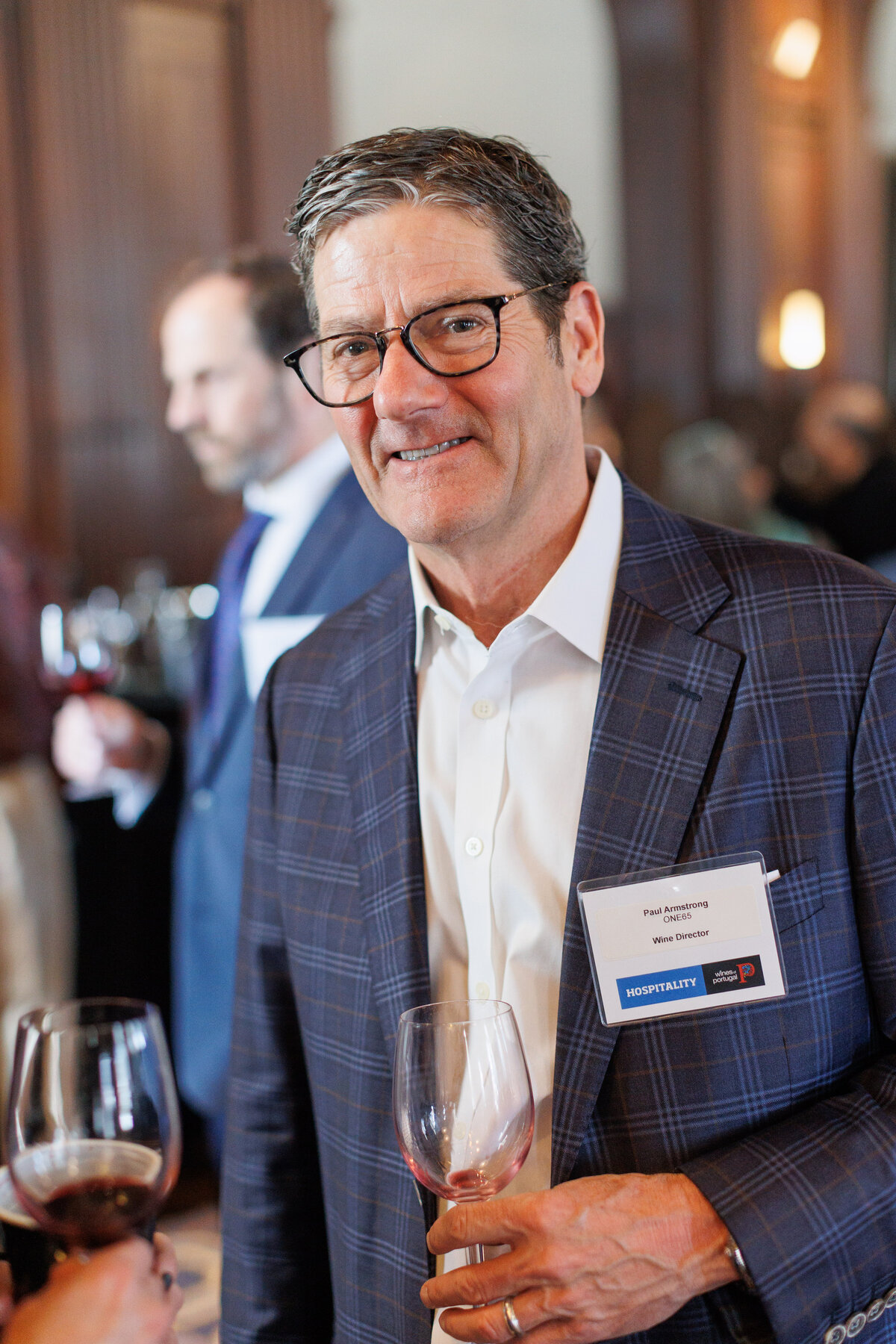 Man holding a glass of wine