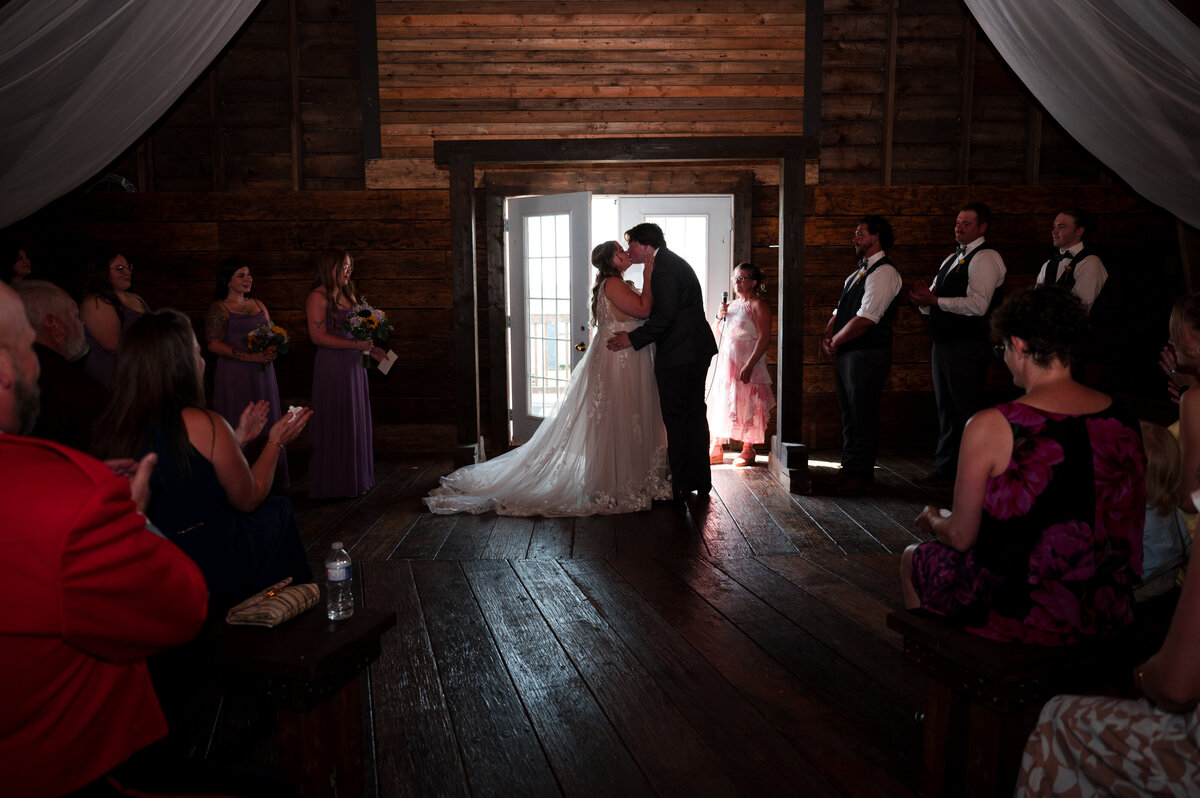 bride and groom first kiss 