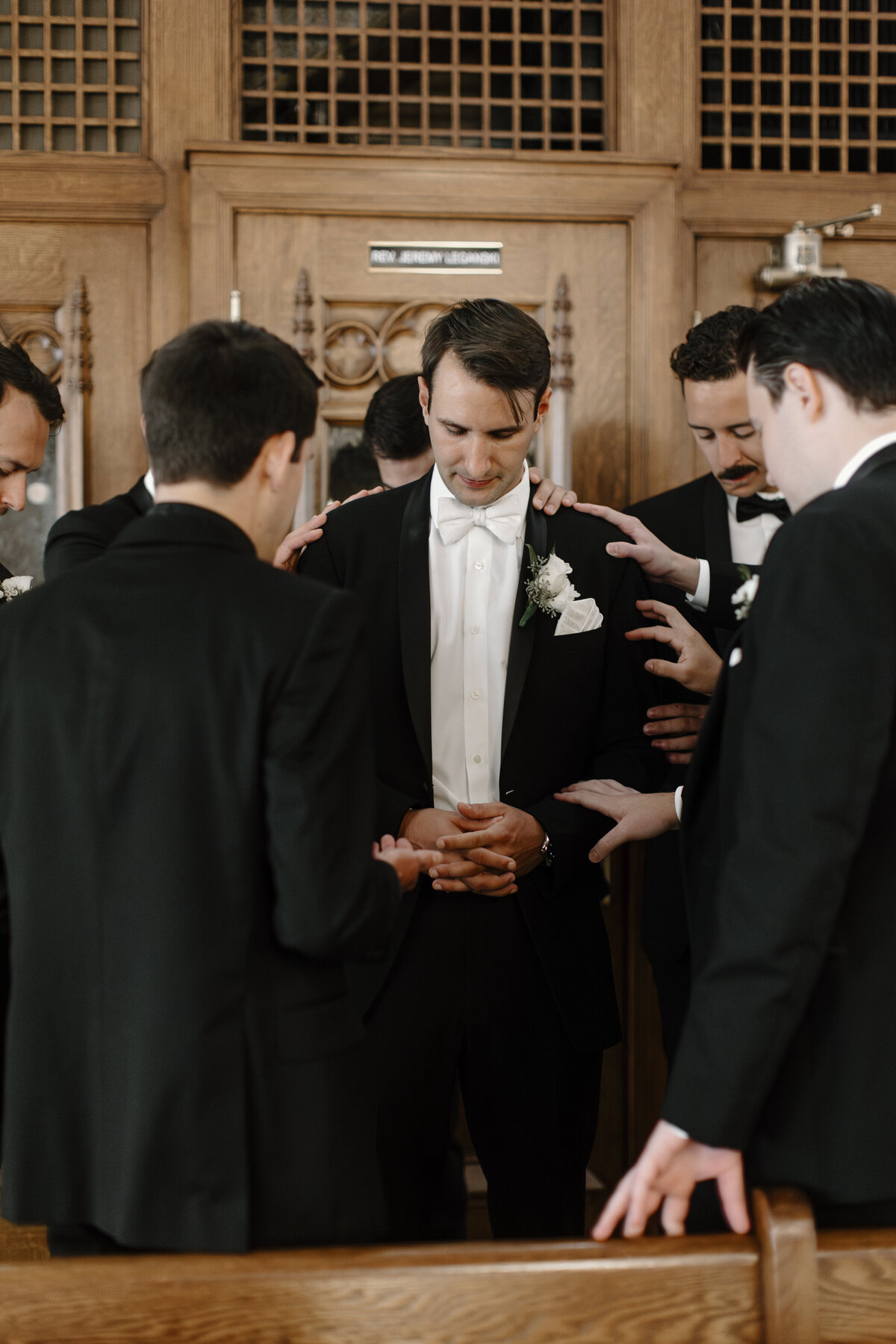 groomsmen praying