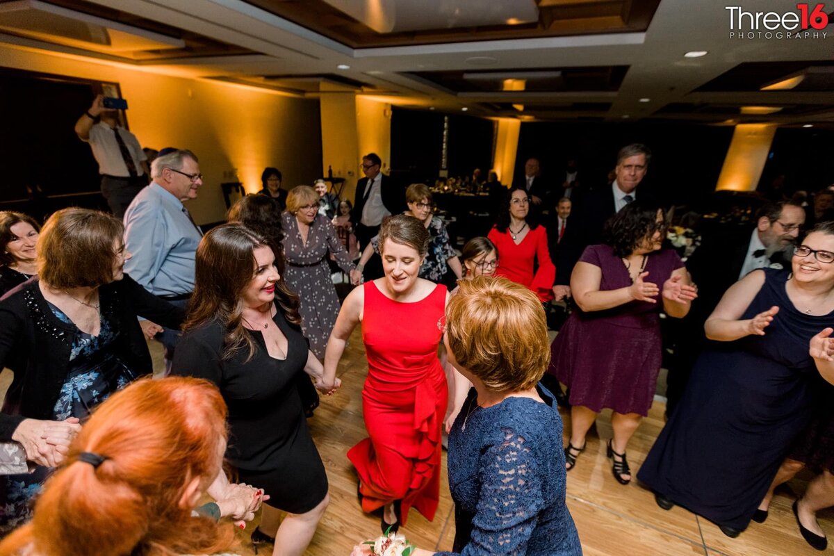 Women dancing at a wedding reception