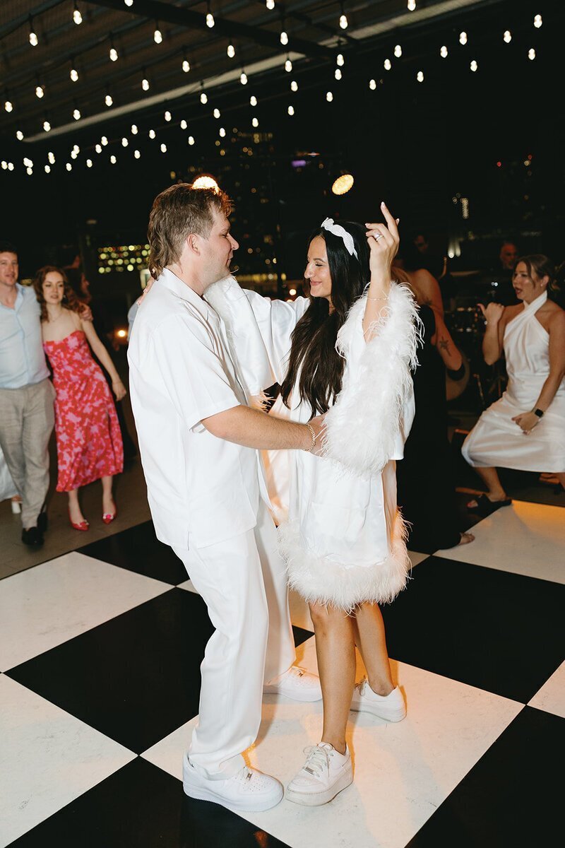 bride and groom dancing at penthouse at riverside wharf wedding