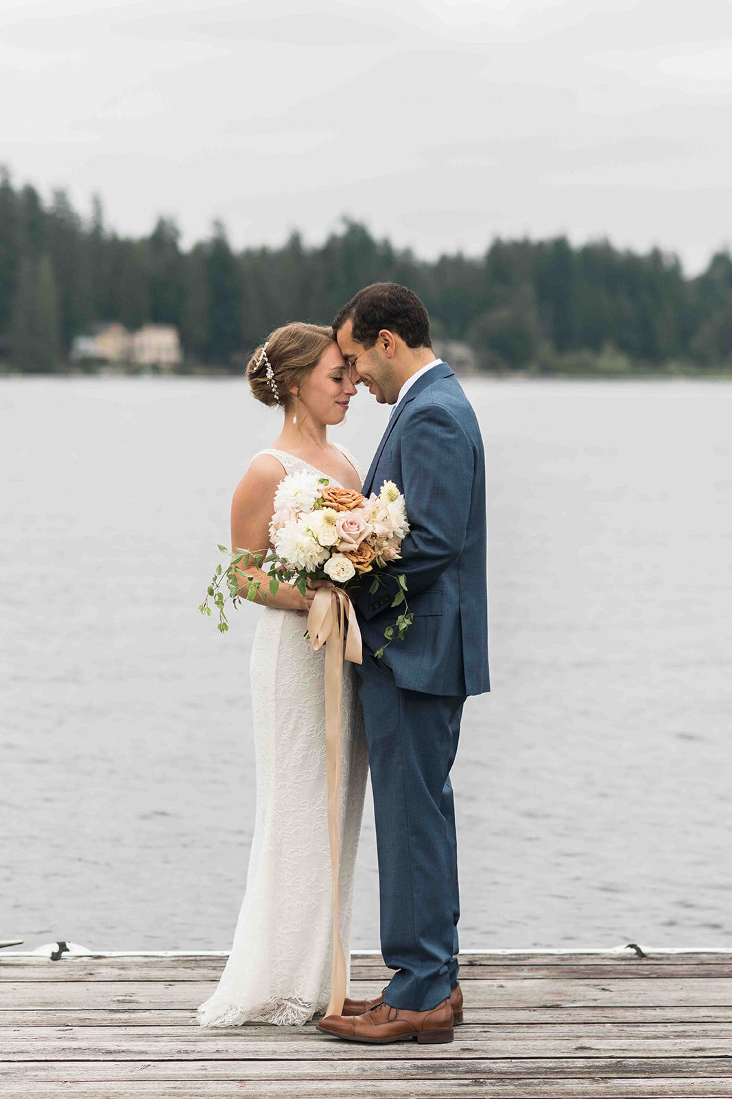 Photos by Joanna Monger Bride and Groom on the dock at Greengates at Flowing Lake