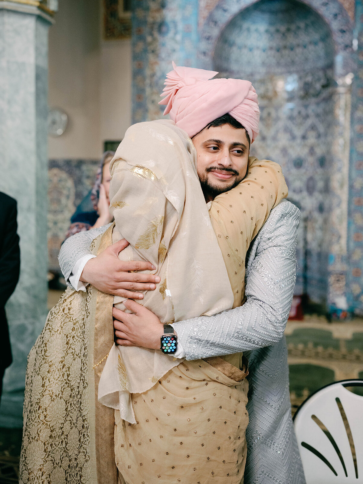 Photo of mom hugging her son after his nikah ceremony