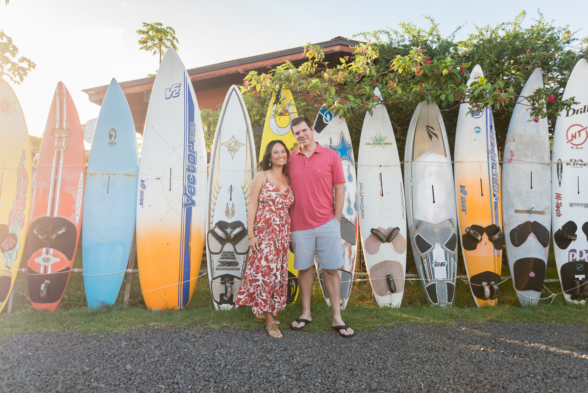 photo with surfboards in the background
