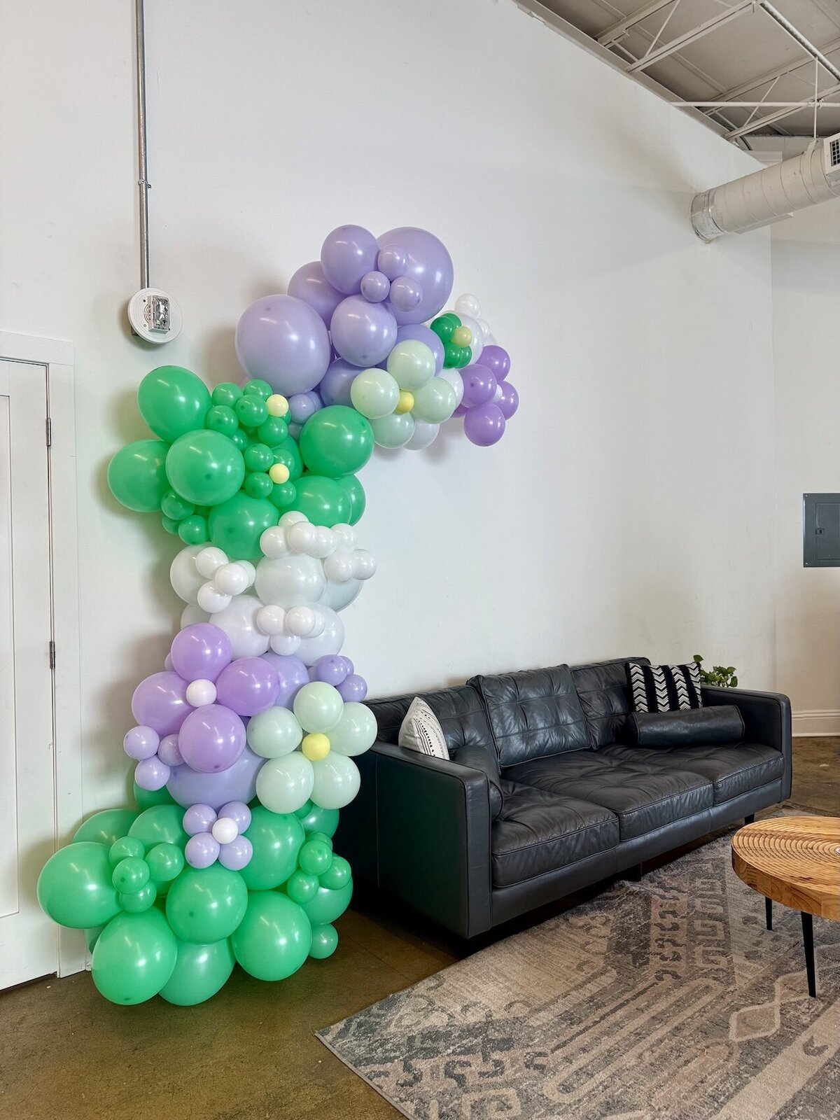 Corporate Event Balloon Garland in purple, green, and white 