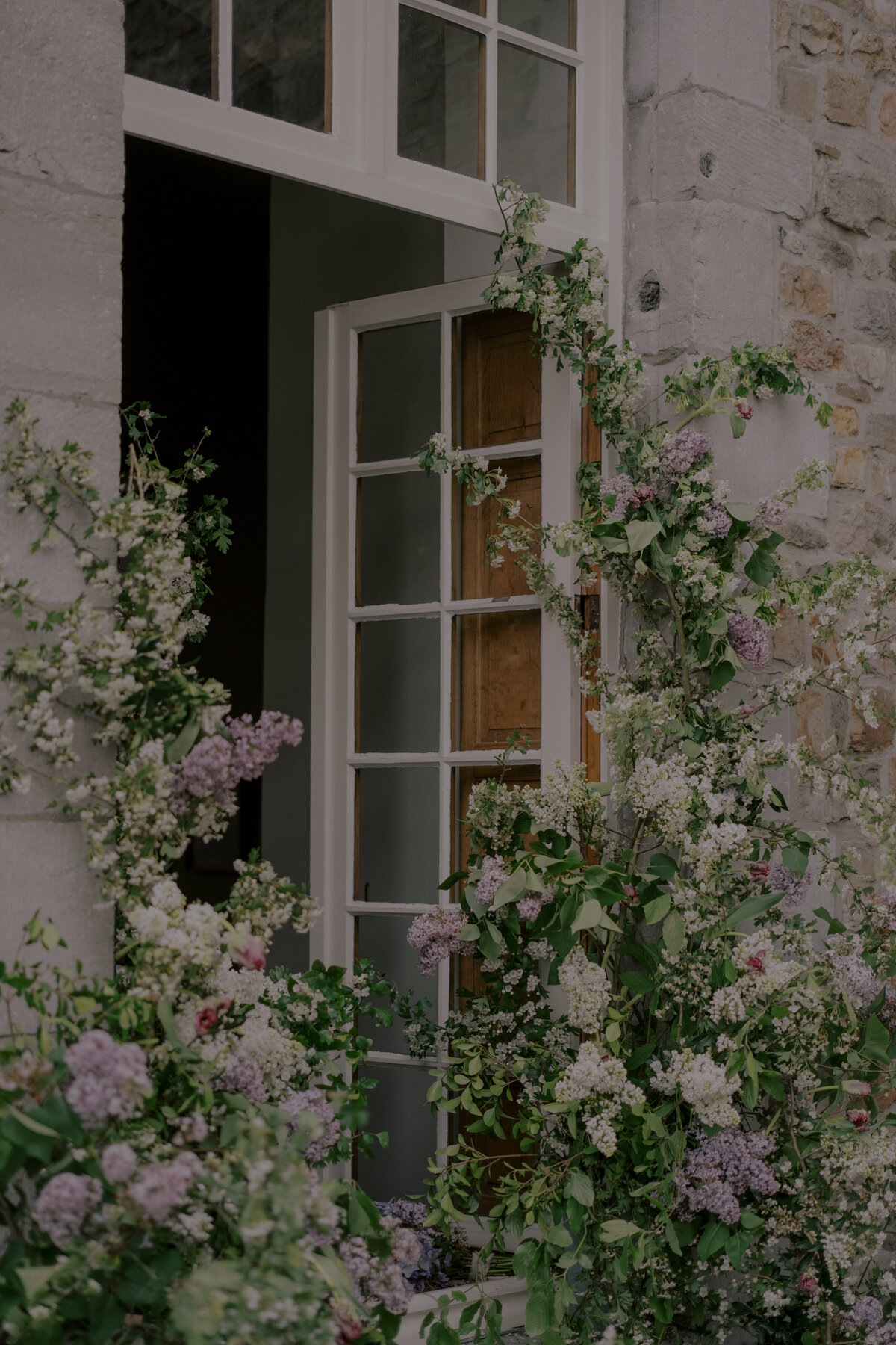 Lilacs grow around a wedding venue in New England.