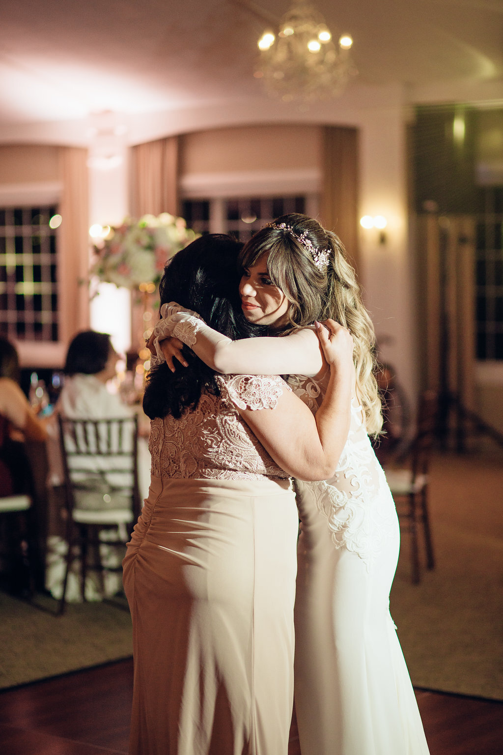 Wedding Photograph Of Bride Hugging The Woman In Light Brown Dress Los Angeles