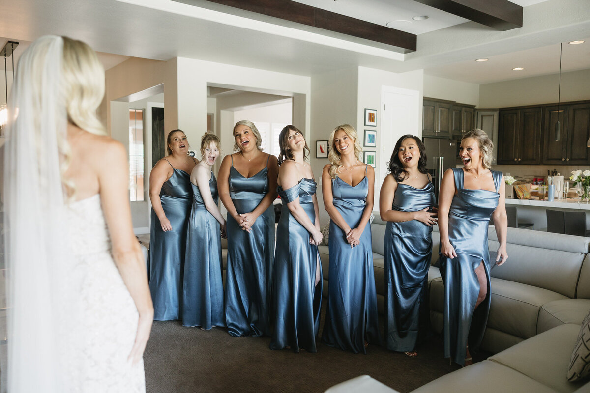 Bridesmaids reaction during first look with bride