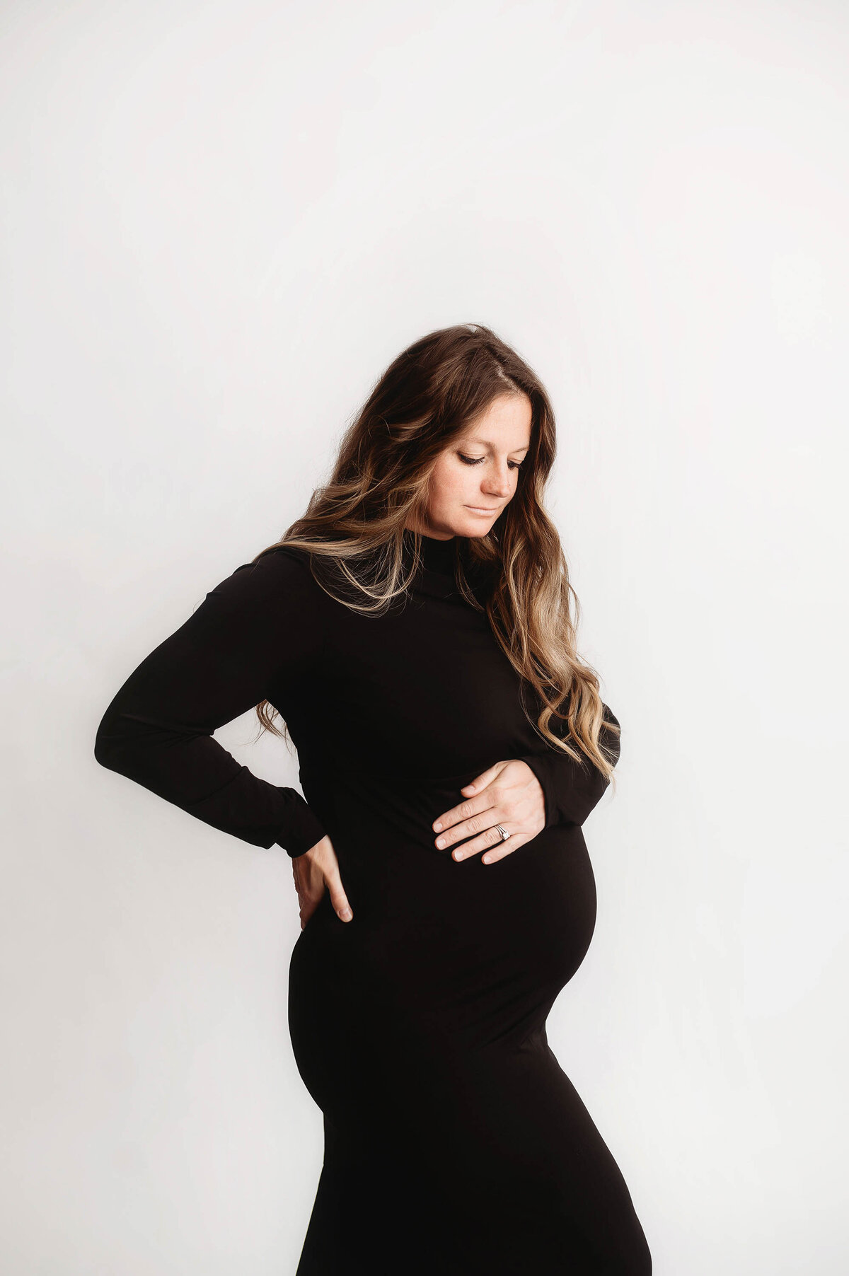 Expectant mother poses for Maternity Photos in Charleston, SC.