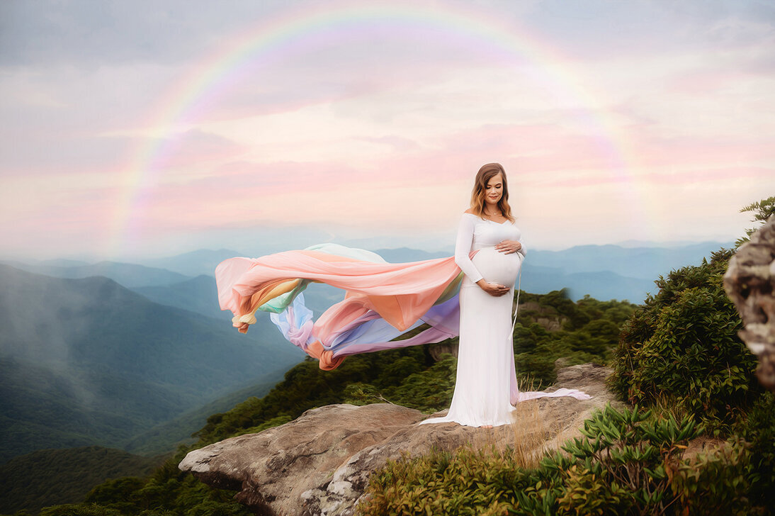 Pregnant mother poses for Maternity Photoshoot on a Mountain top in Asheville, NC.