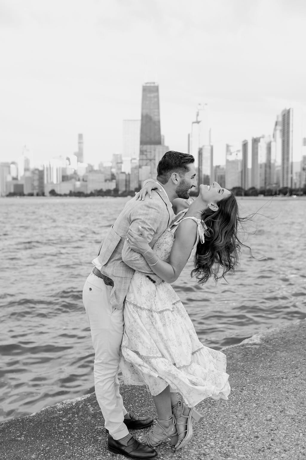 An engagement photography session at The Wrigley Building and North Ave Beach in Chicago, Illinois - 27