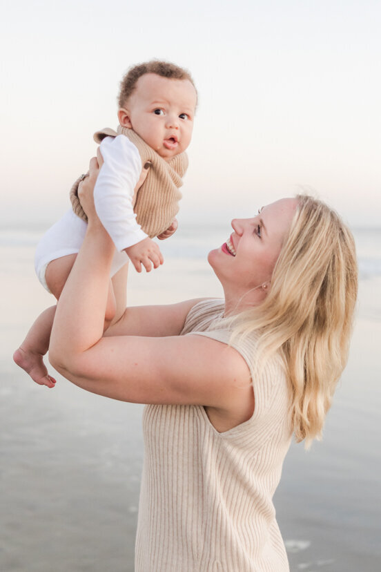 family-portrait-mother-holding-up-son-Coronado-beach-san-diego