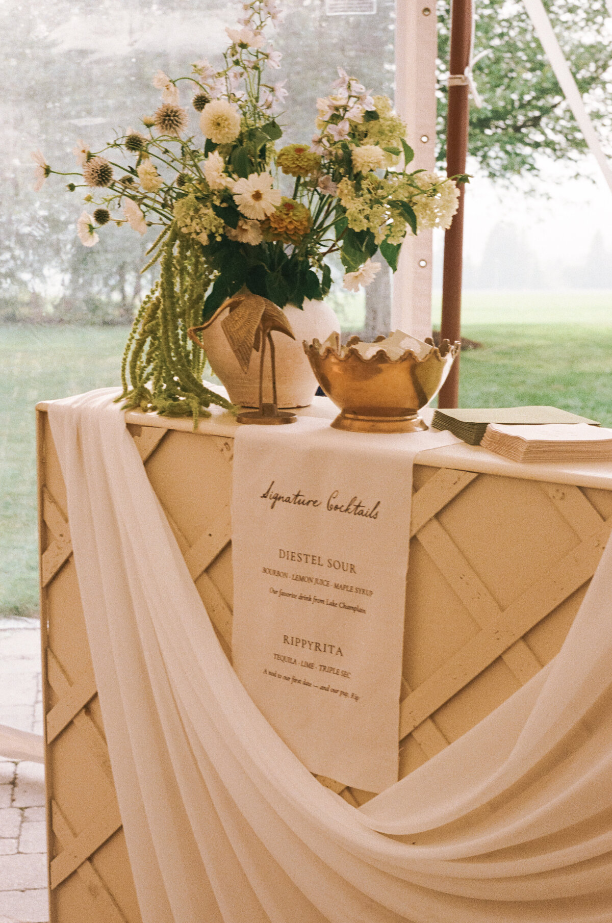 Sophisticated editorial detail photography showcasing luxury wedding
  aesthetics at Lion Rock Farm destination venue. Lauren Alatriste's fashion forward
  approach elevates traditional wedding documentation, creating imagery that feels both
editorial and authentically celebratory.