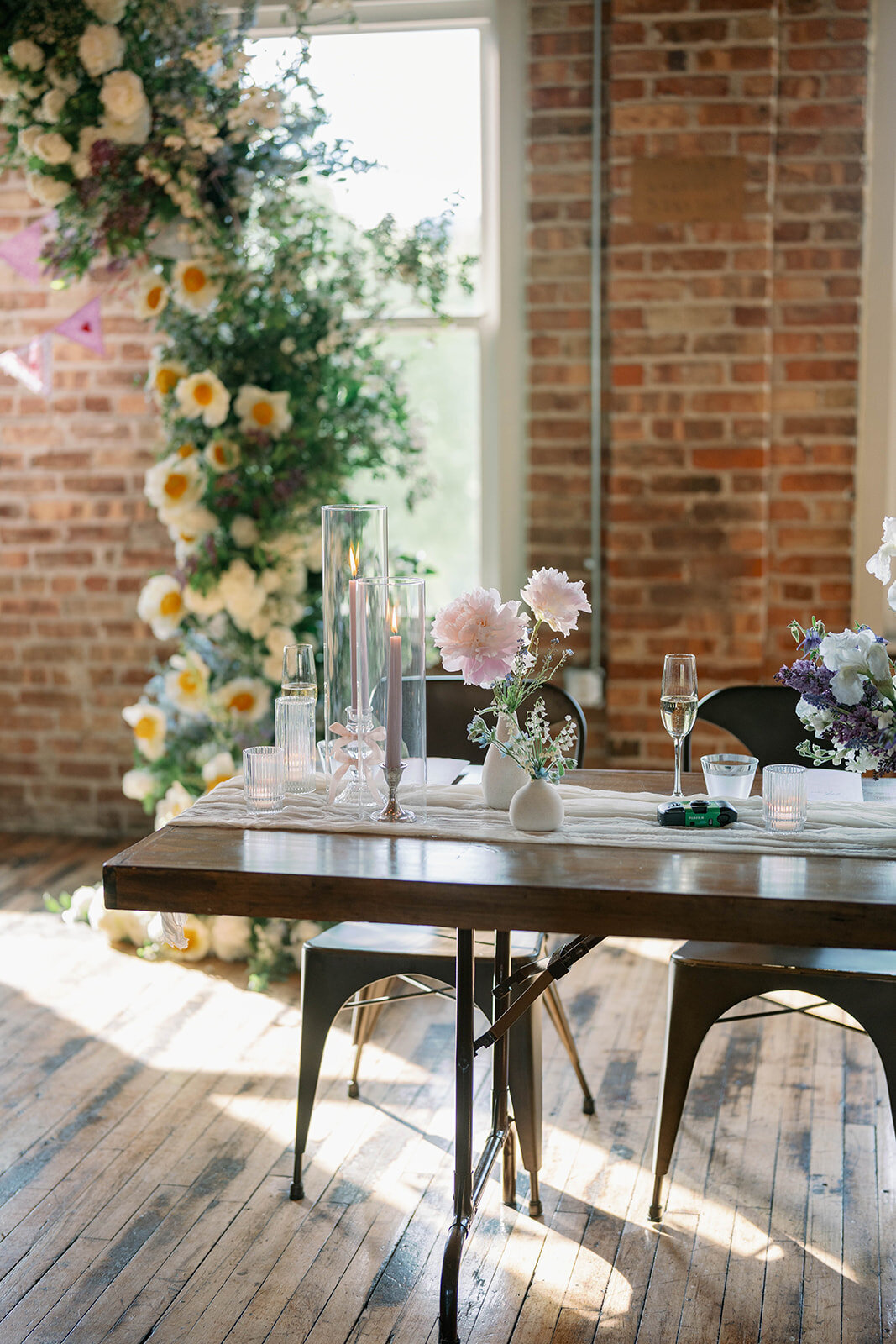 Floral installation and sweetheart table decor at spring Michigan wedding