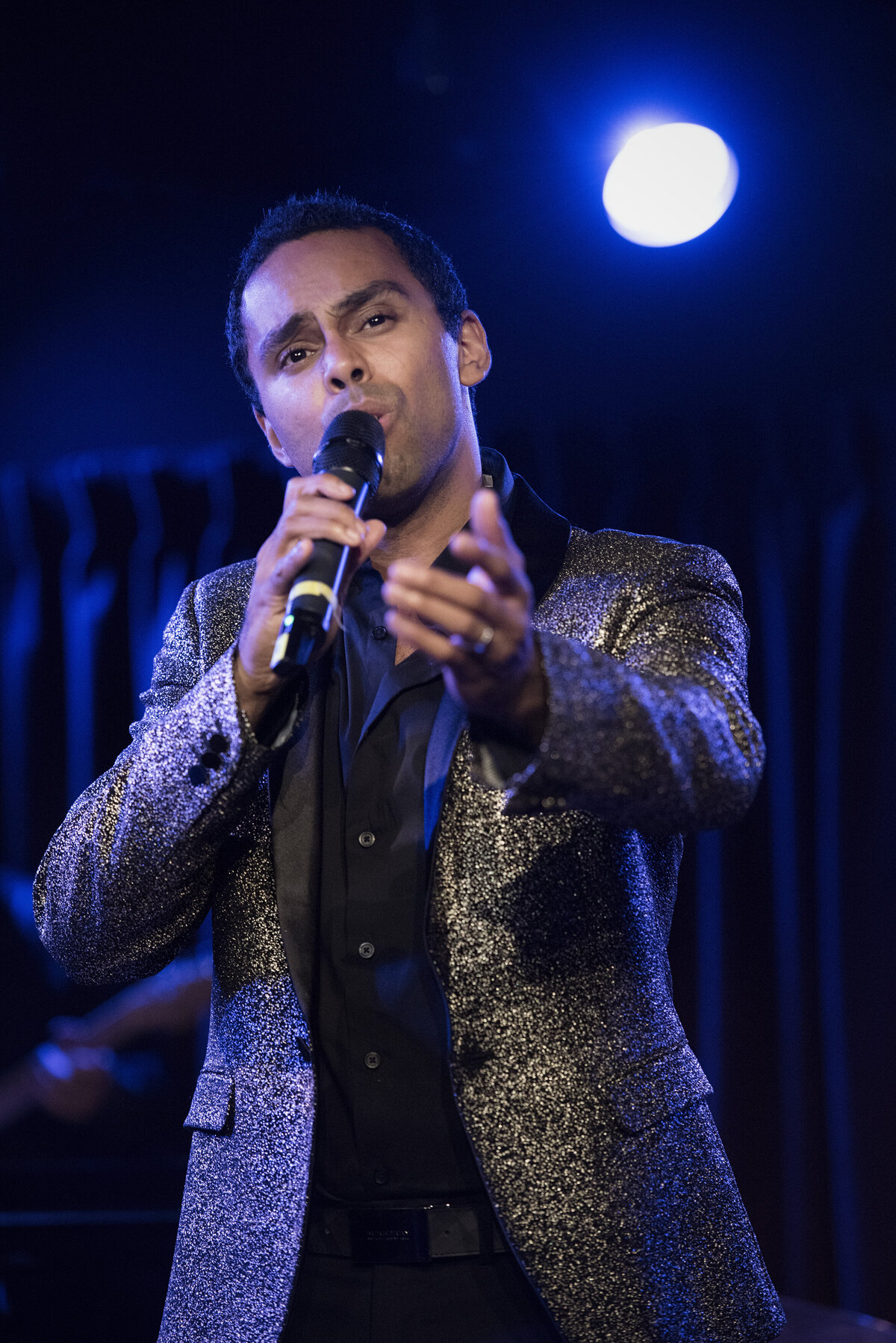 A person on stage singing