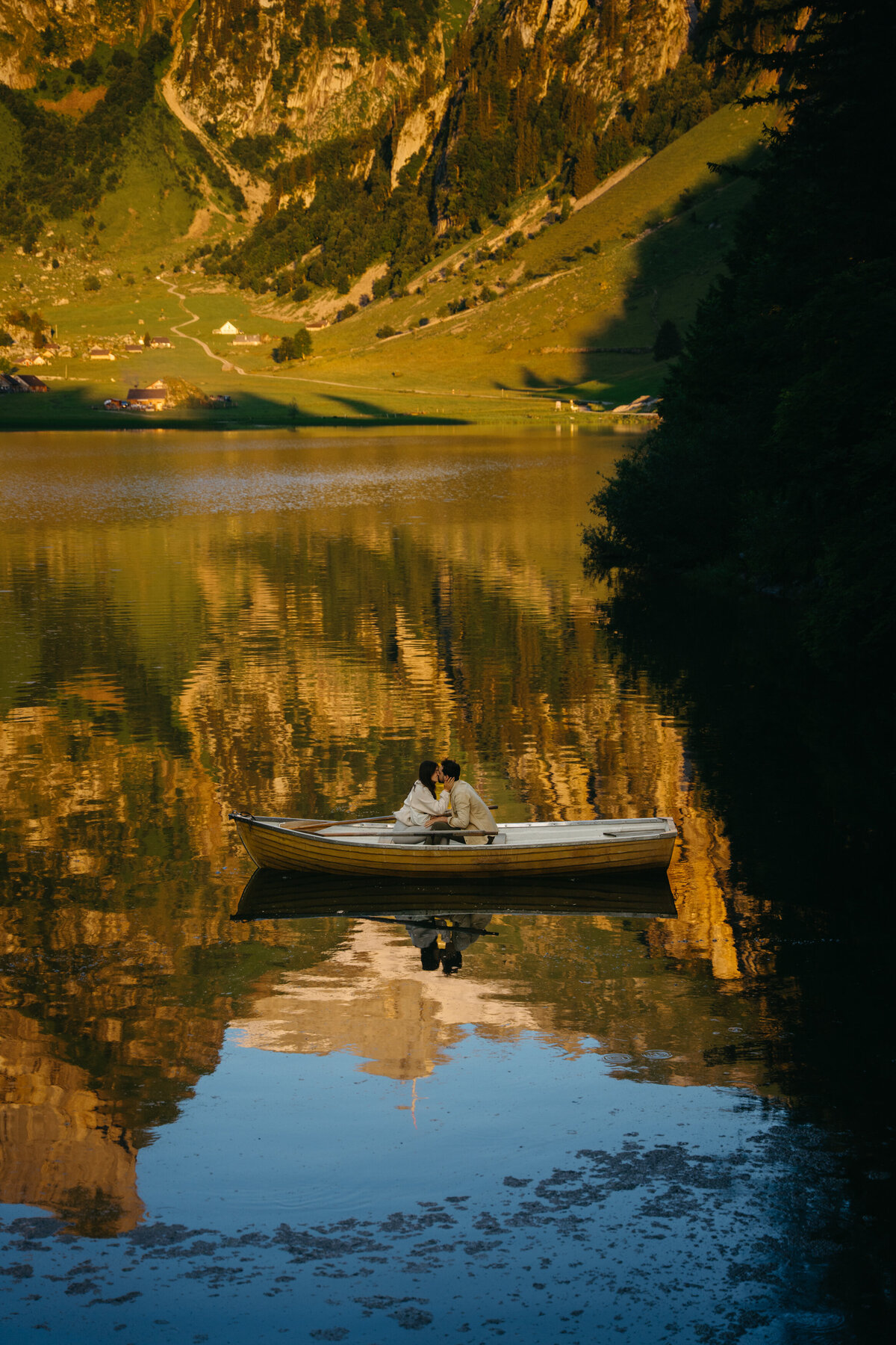 Sunrise at Seealpsee in Switzerland with eloping couple