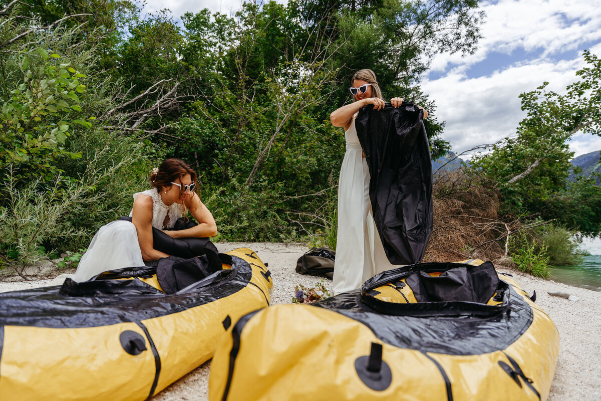 Brides paddling Soča Valley river elopement
