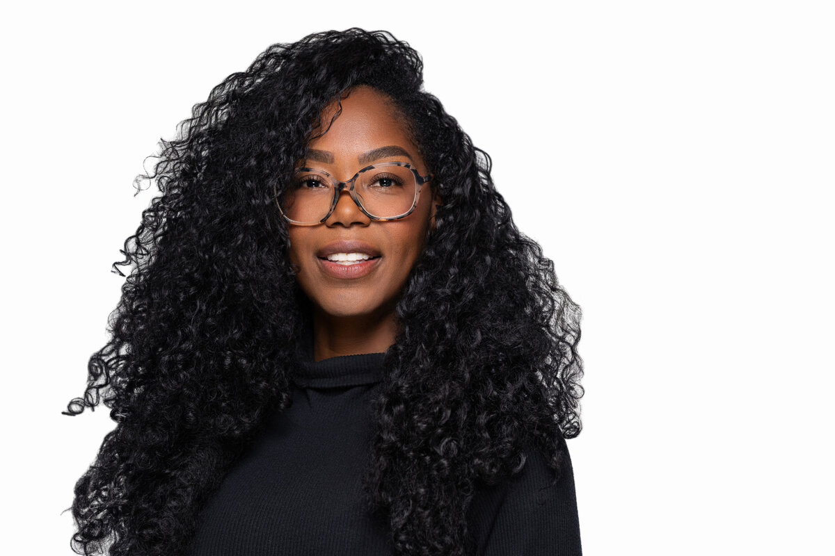 professional headshot of young professional on white background