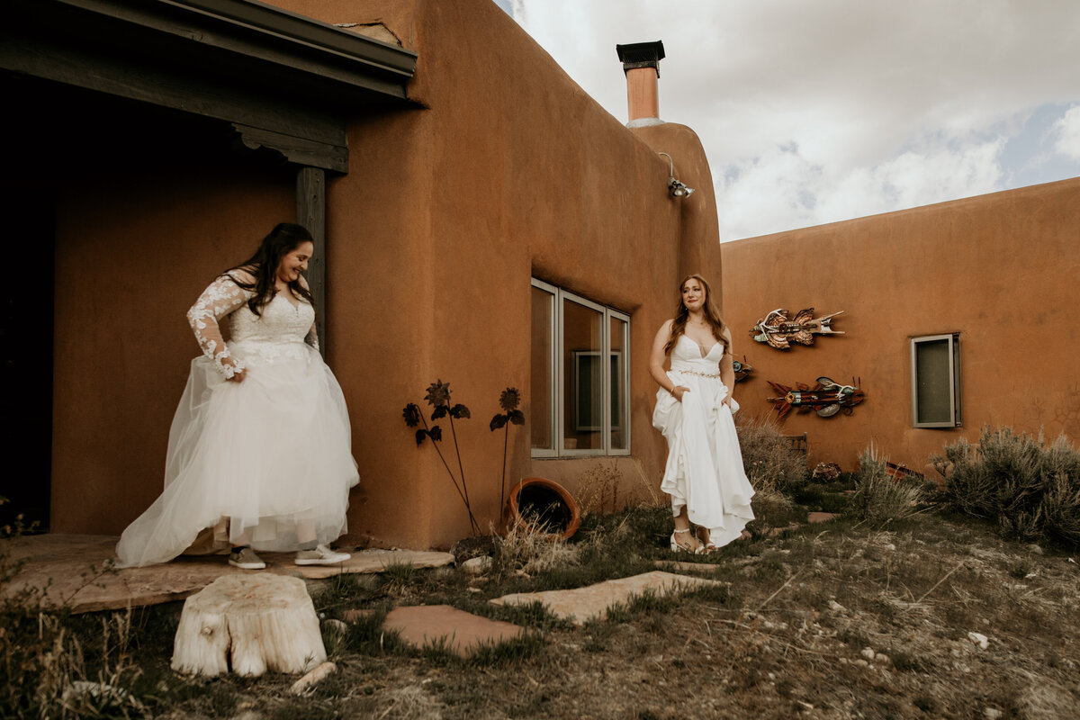 same sex couple about to see each other in gowns for the first time