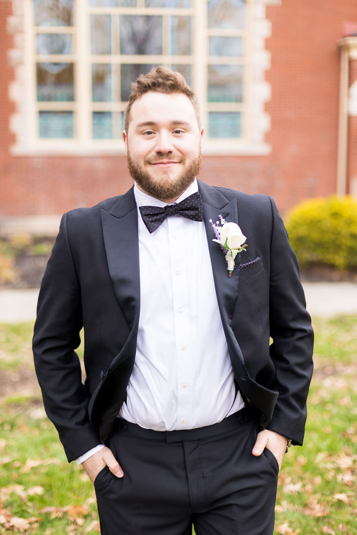 Groom wearing tuxedo from The Black Tux
