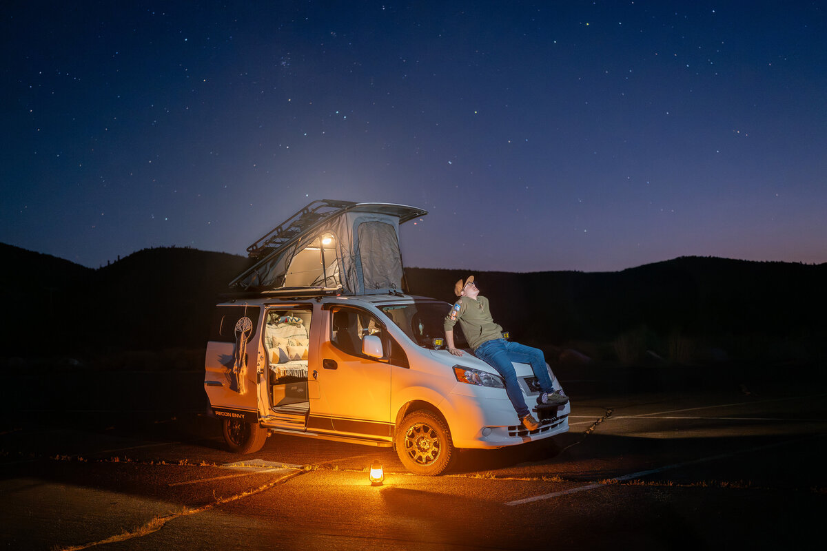 Peter 3 Photography, a Joshua Tree and Yosemite Elopement Photographer stargazing at night in his camper van.
