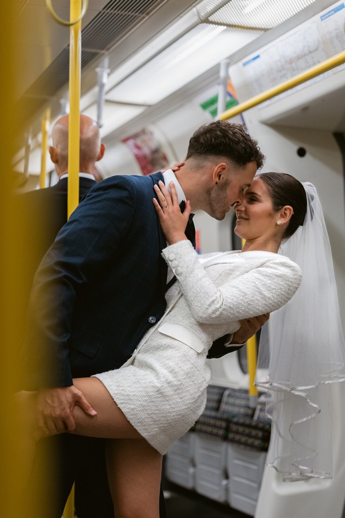 timeless-romantic-luxury-wedding-modern-groom-london-bride-londonwedding-iconic-tube-kiss-photography