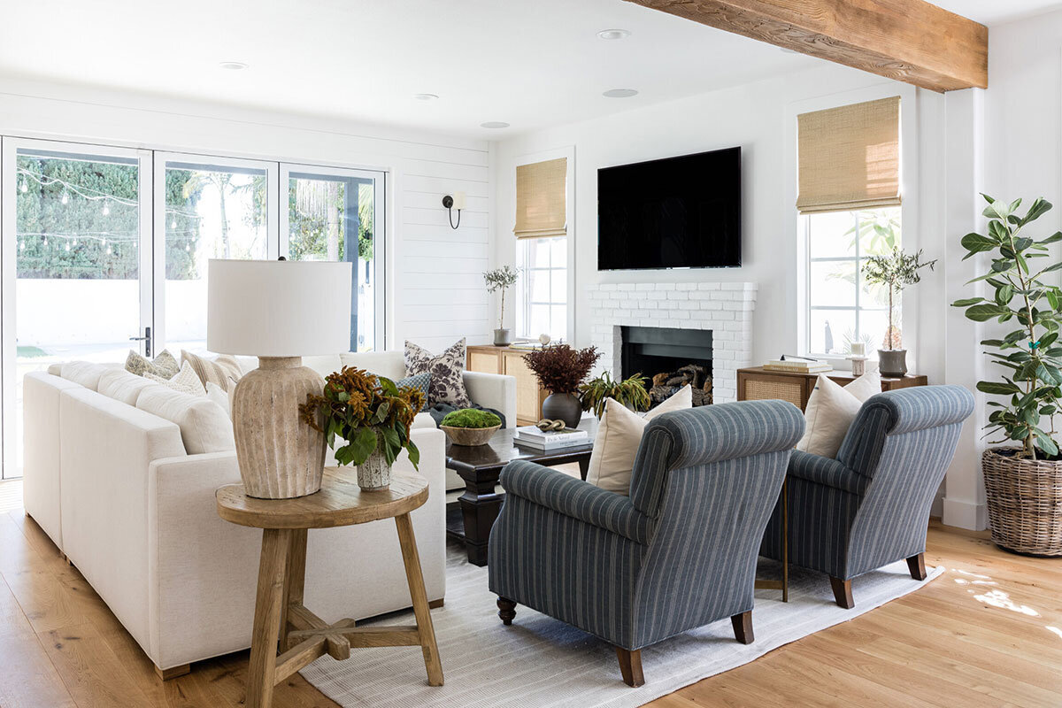 Cozy coastal cottage living room with warm woods and neutral palette in Costa Mesa
