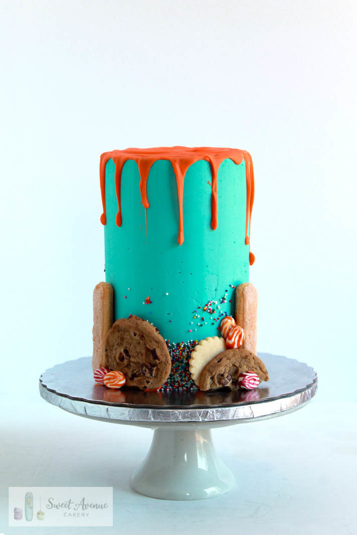 double barrel teal chocolate drip cake