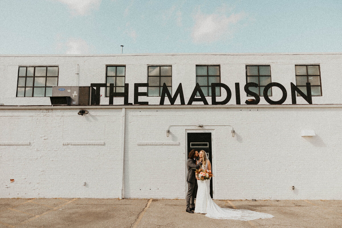 Bride and Groom outside of Modern Industrial Venue