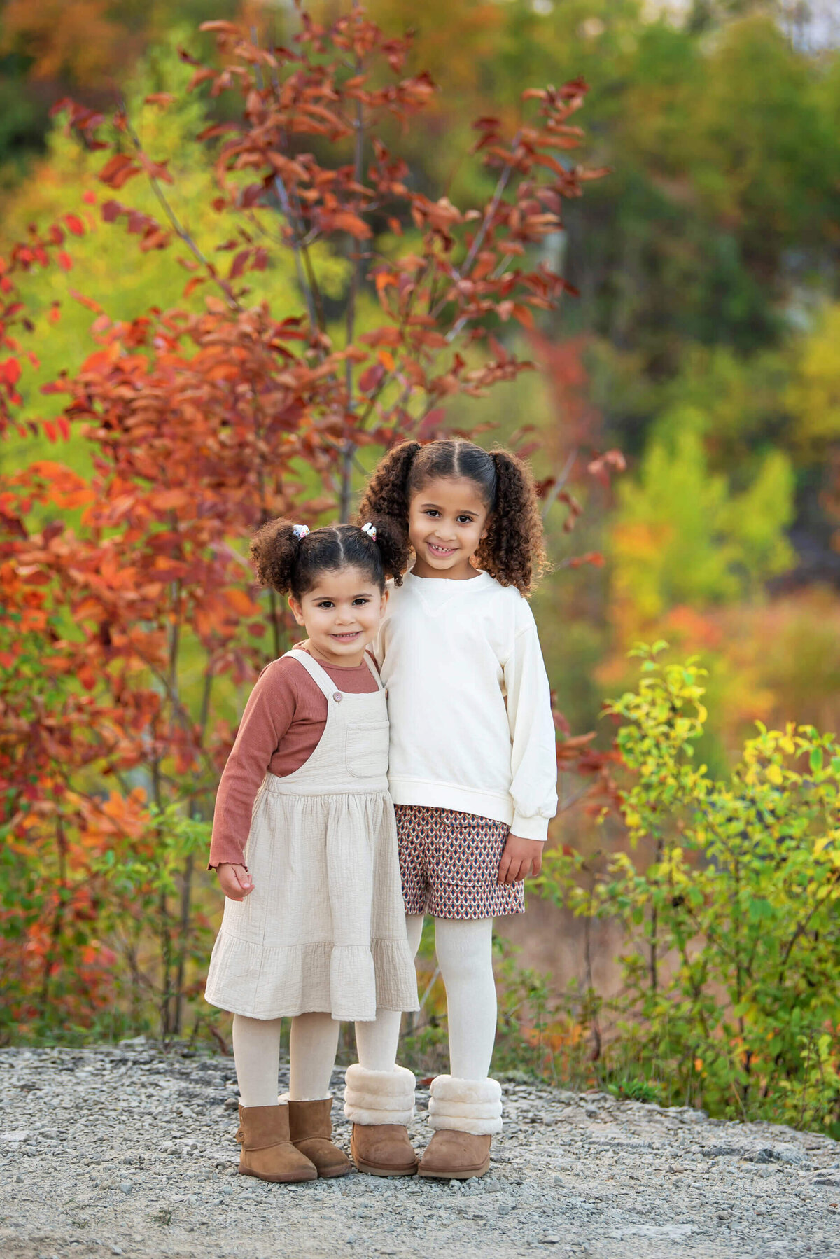 Two sisters hugging for their fall family photos in Burlington, On