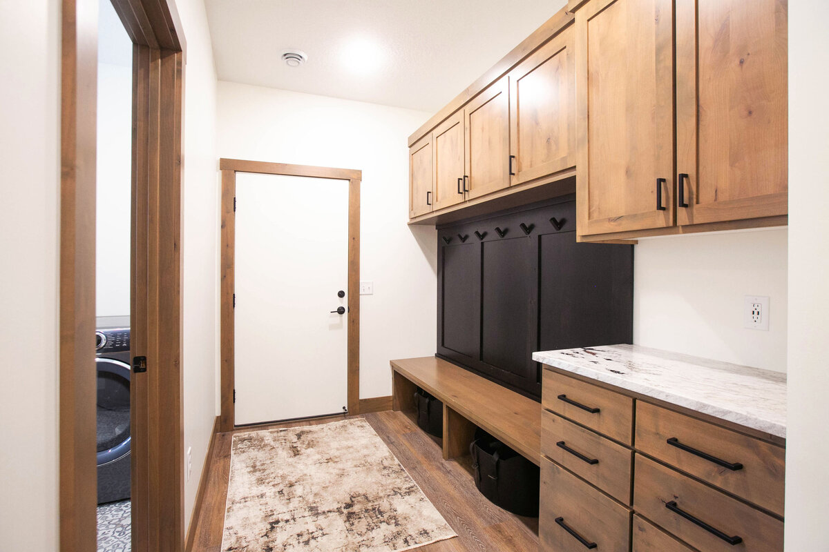 Back Entry with wood flooring and built in lockers n a custom-built Elk River home