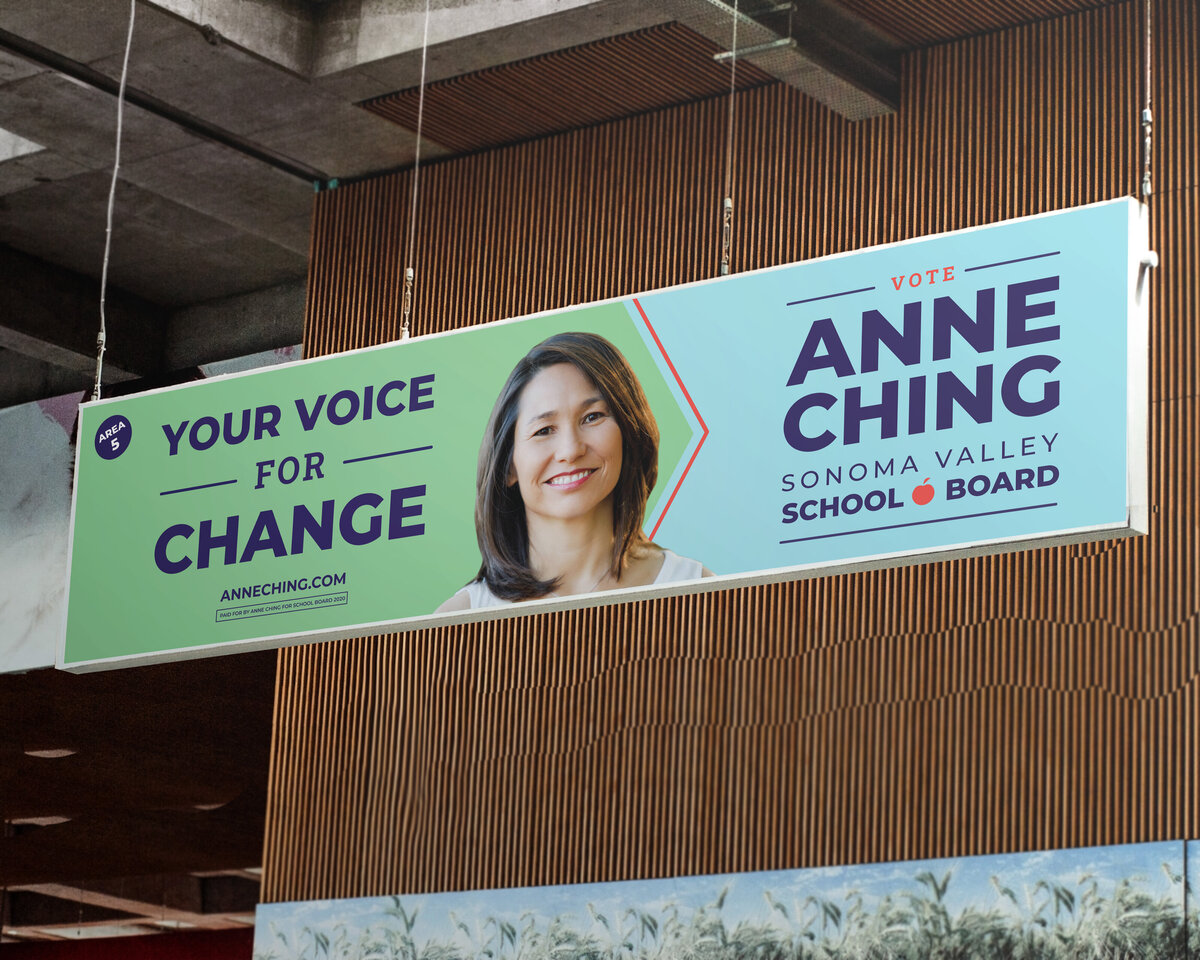Banner with woman's face on it that reads "your voice for change"