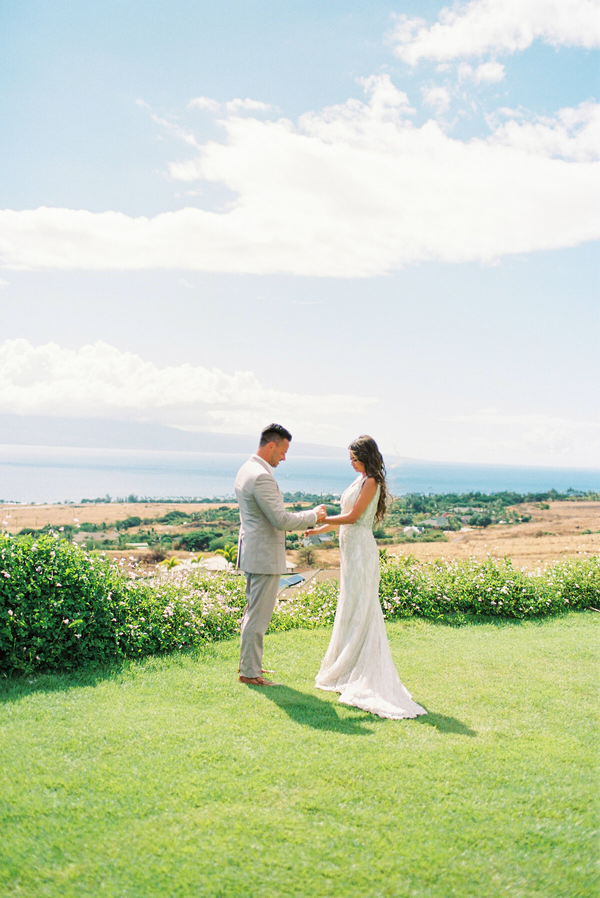 bride and groom saying vows in maui