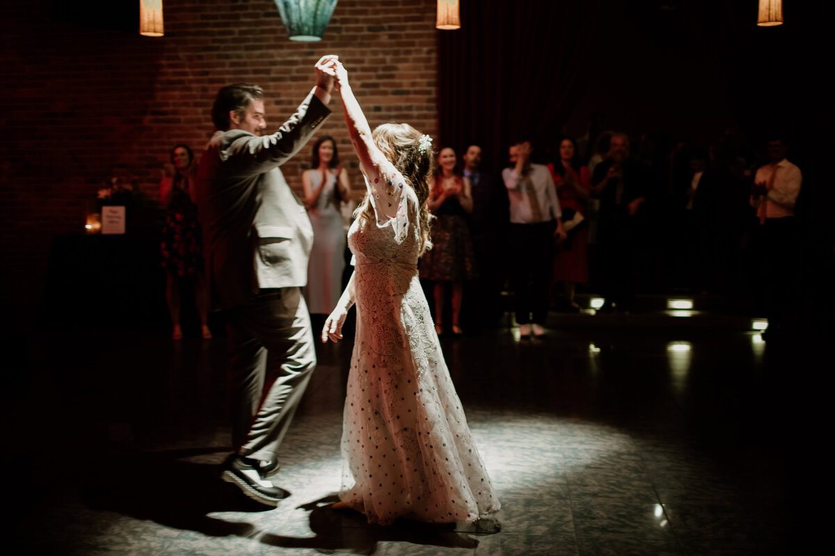 A bride and groom’s first dance at the Georgetown Ballroom in Seattle. Captured by Fort Worth wedding photographer, Megan Christine Studio