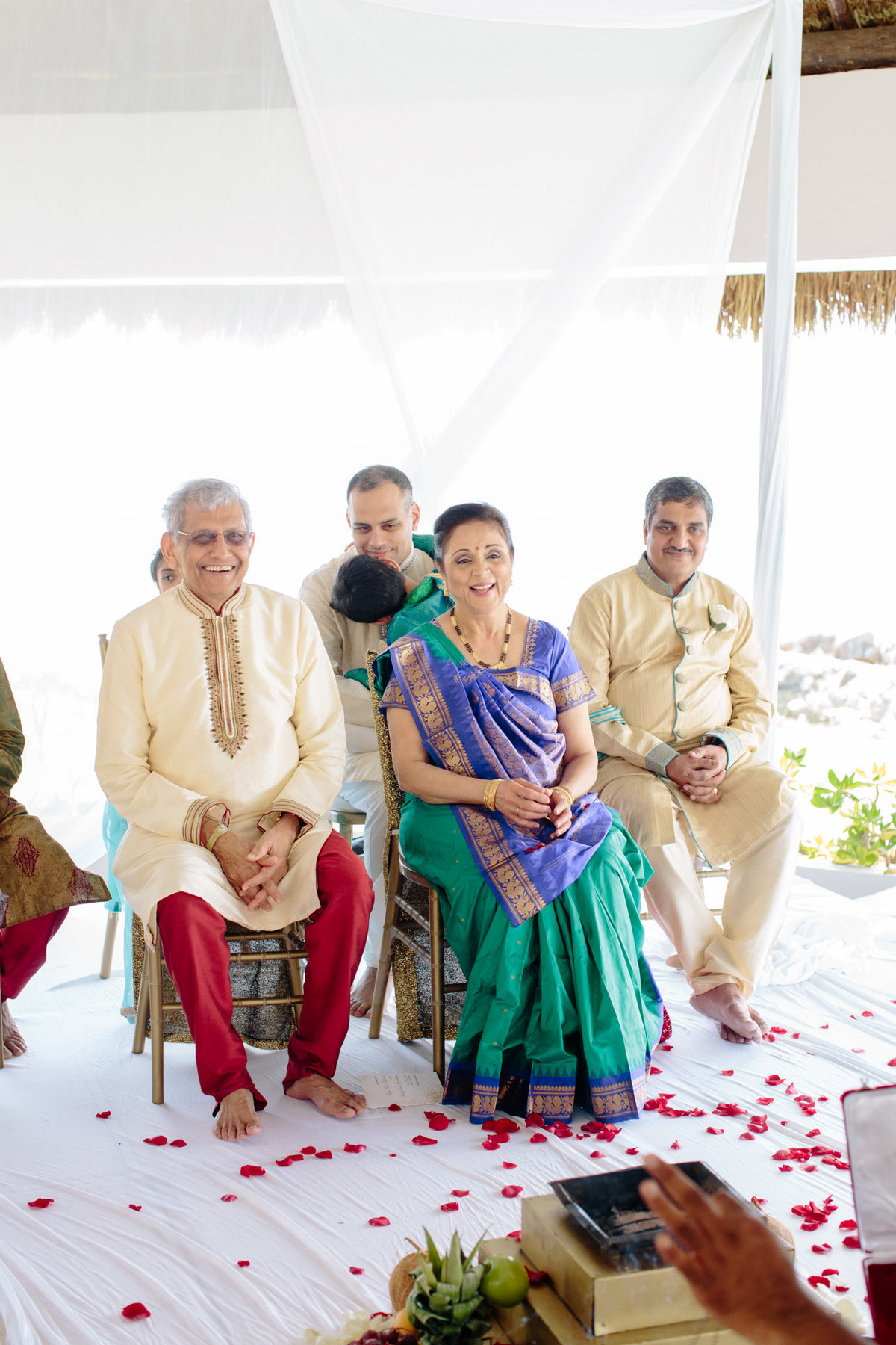 Parents of the bride watch as their daughter marries the love of her life. Photo by Rebecca Cerasani.