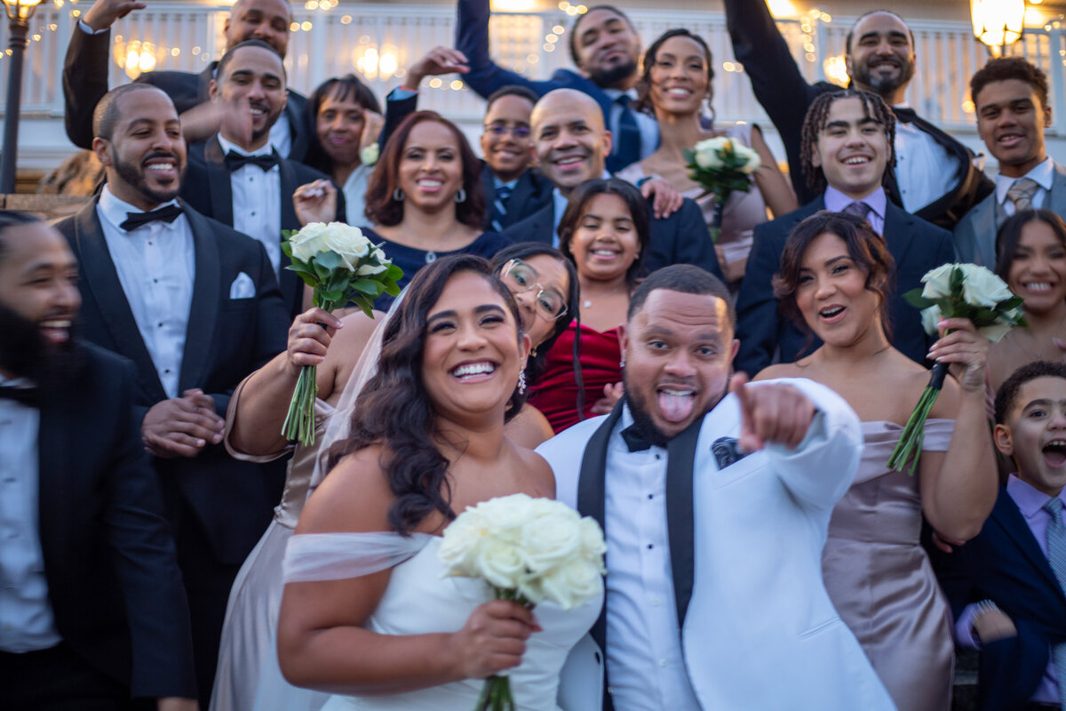 Bride and groom surrounded by their wedding party