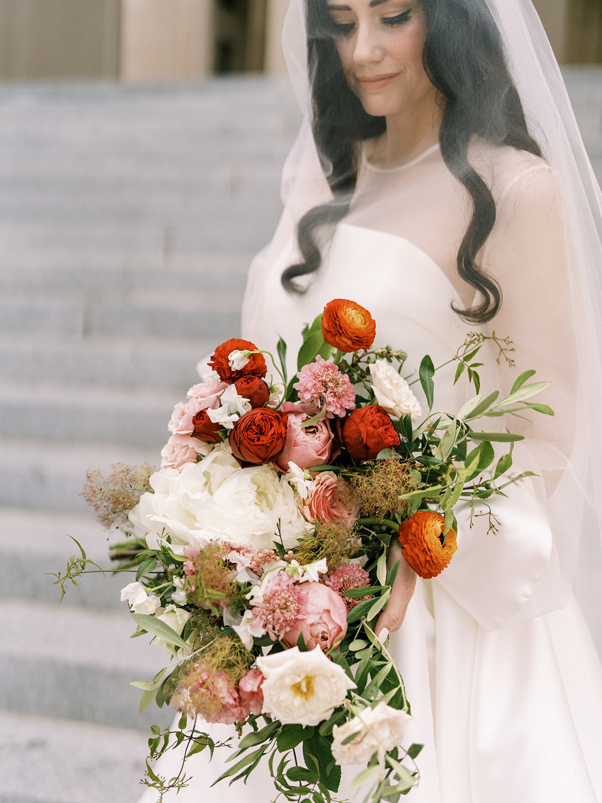 Artful floral design for bridal bouquet. Wedding florals in shades of red, pink, blush, and cream. Design by Rosemary & Finch Floral Design in Nashville, TN.
