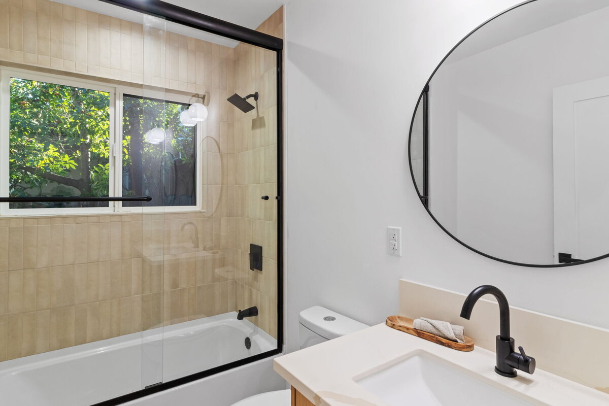 neutral-bathroom-renovation-tan-tile-black-fixtures-aw-development
