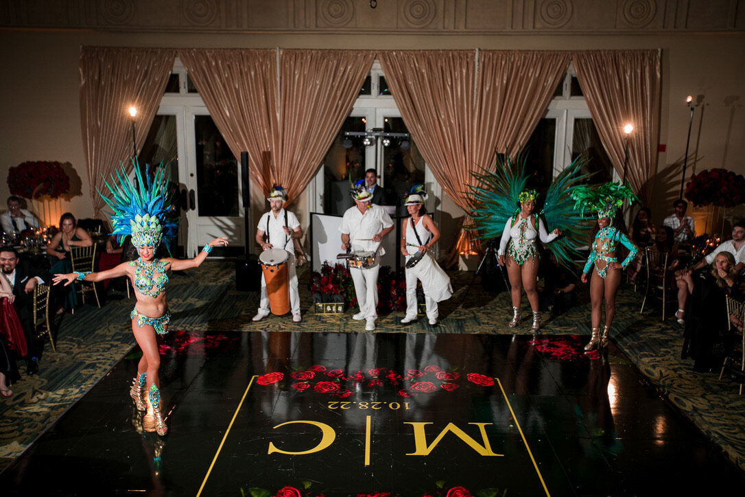 Brazilian dancers, black dance floor, dance floor wrap, DJ, champagne drapery, red roses