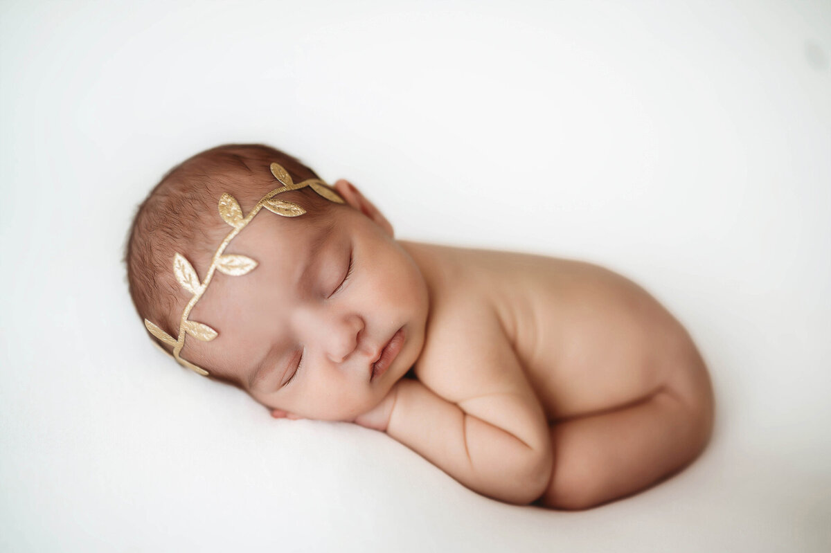 Infant posed for Newborn Photos in Charleston, SC.