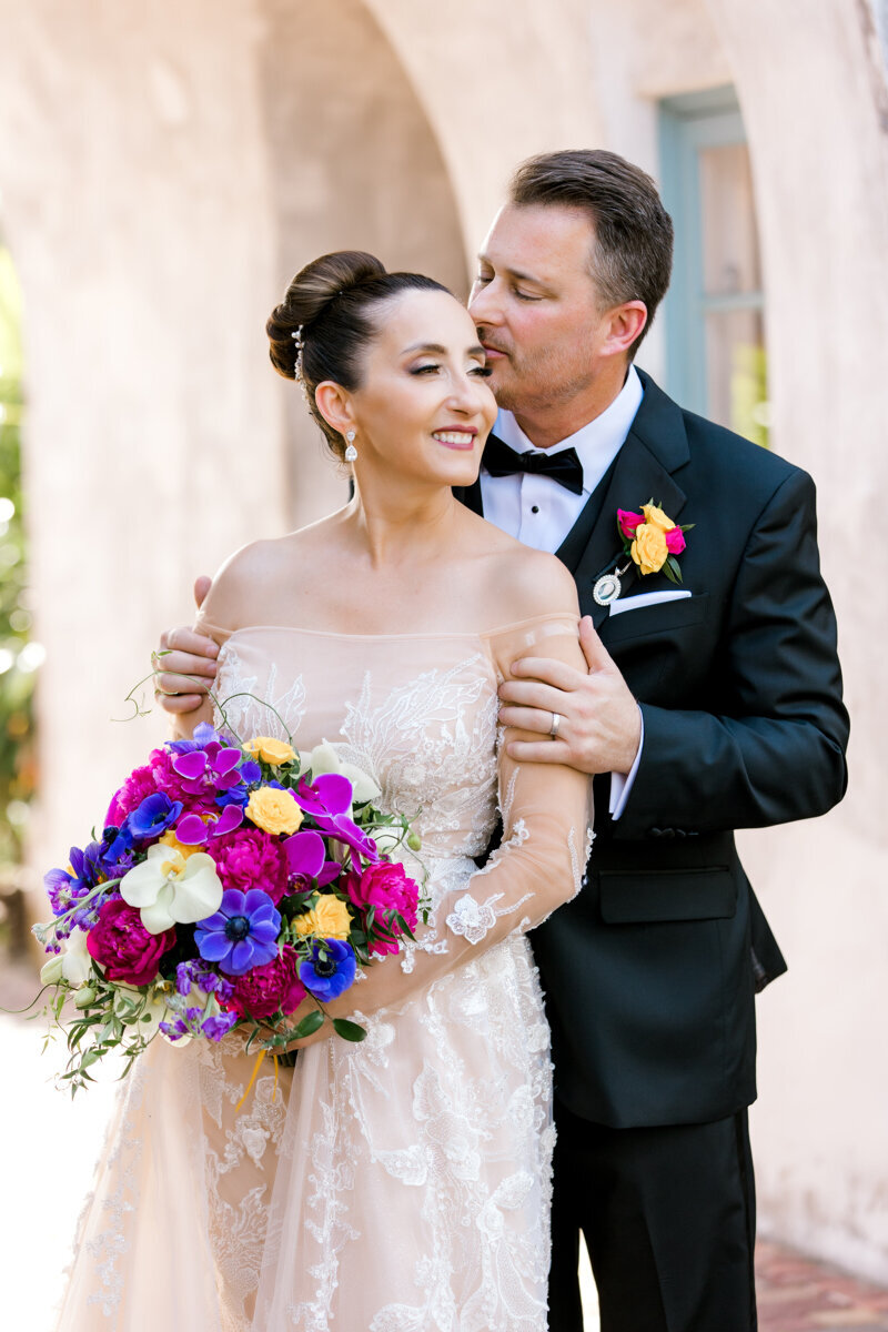 groom kissing bride at casa feliz