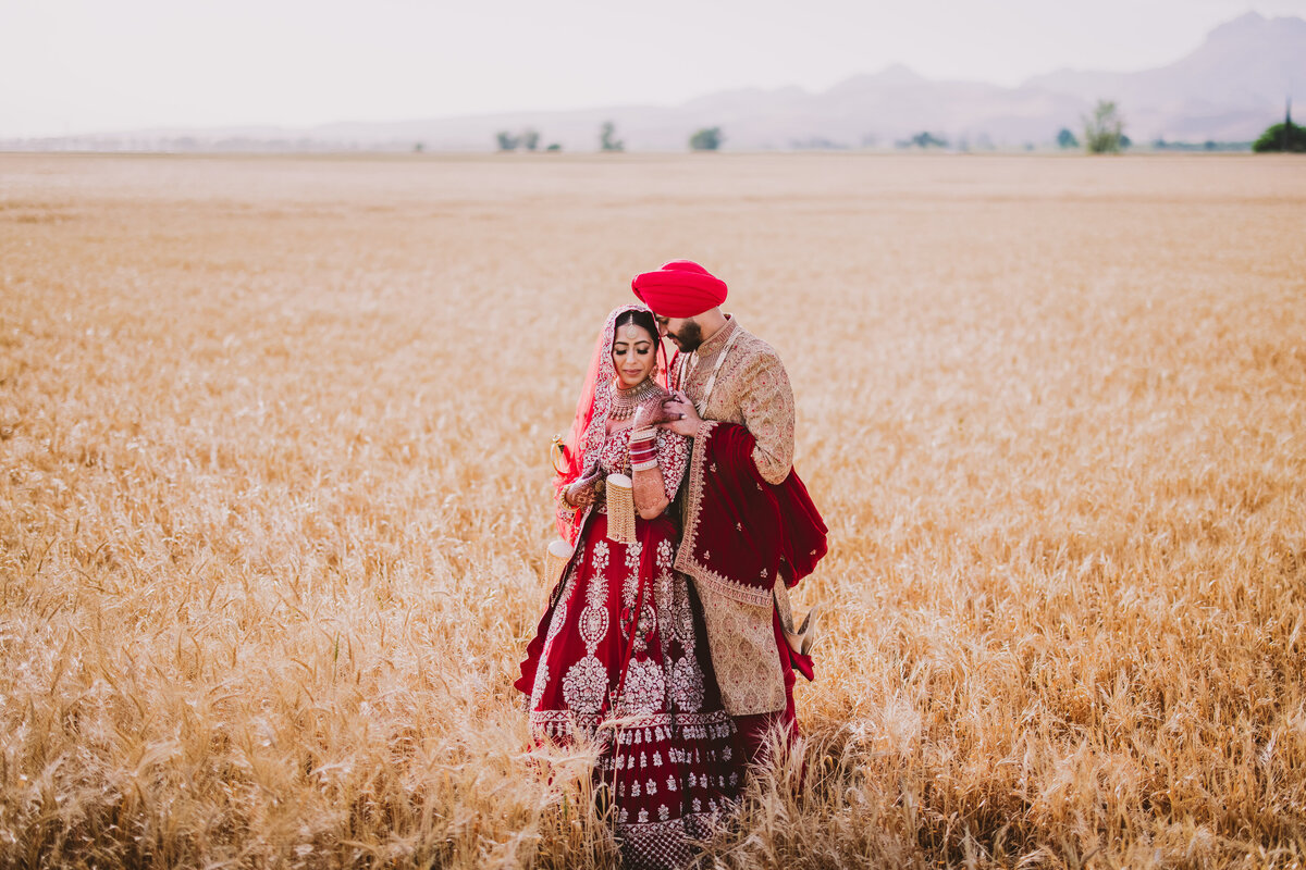 Sikh bride and groom share a moment at an open field in yuba city, california