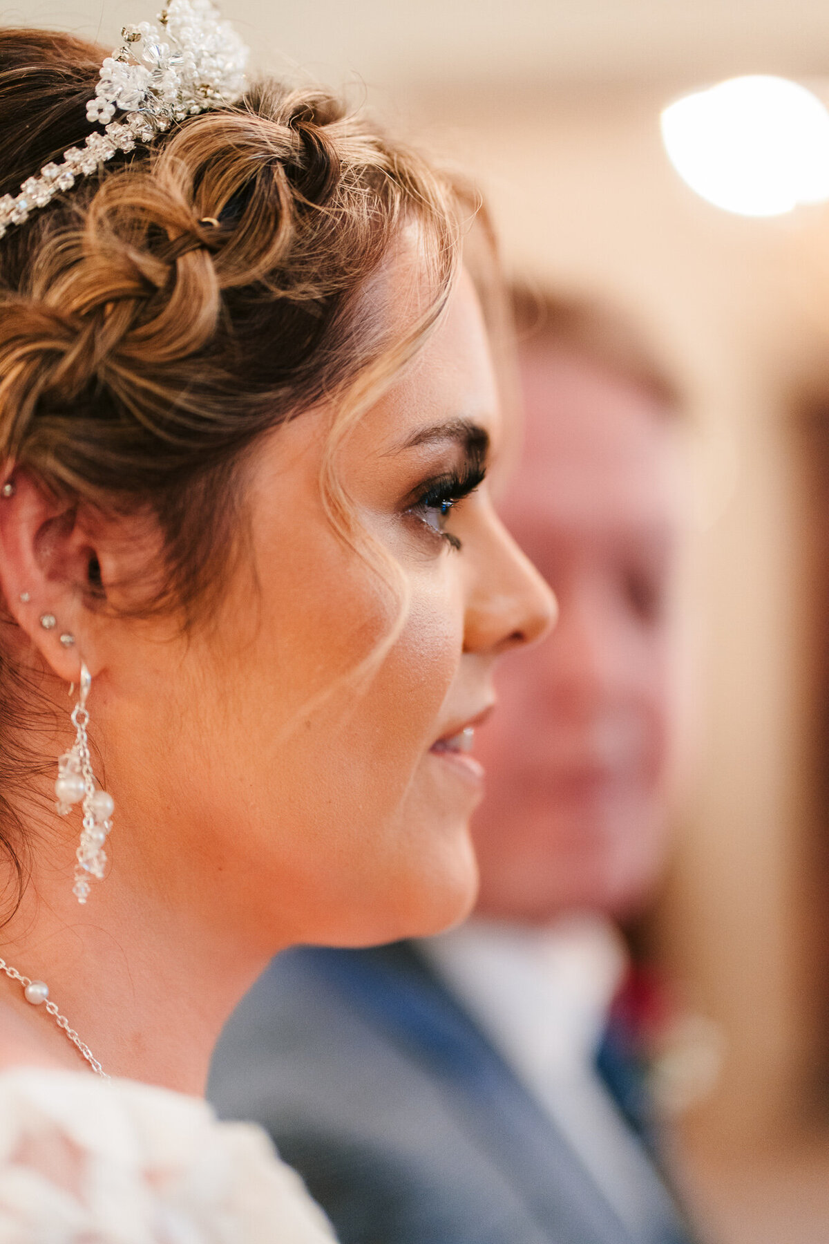 Side shot of bride just before walking done the aisle taken at Merewood Country House Hotel in the lake district taken by Wedding Photographer and Videographer Anthony Horseman