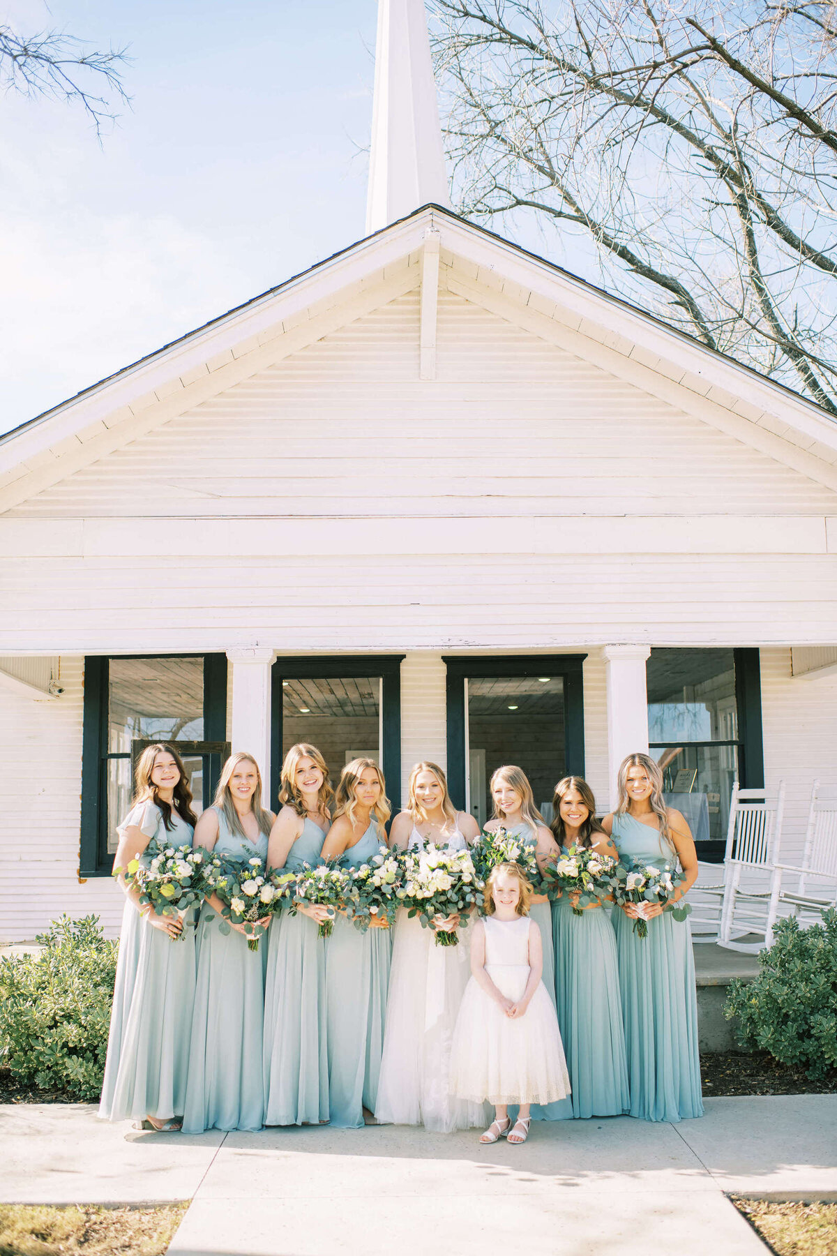 Bridal party standing outside of bridal suite in North Texas wedding