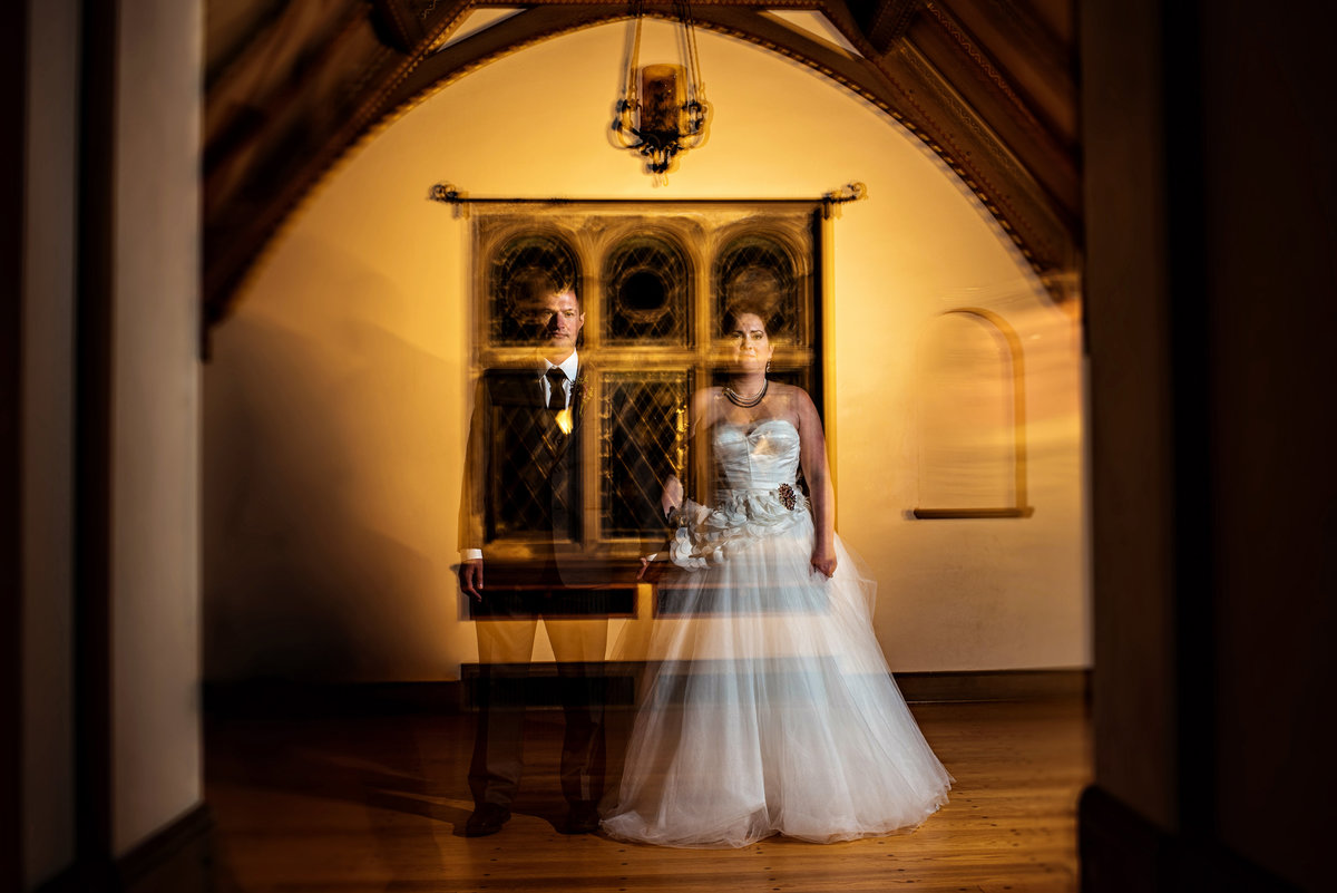 A double exposure of a wedding couple in the haunted venue at gallaher mansion at cranbury park.