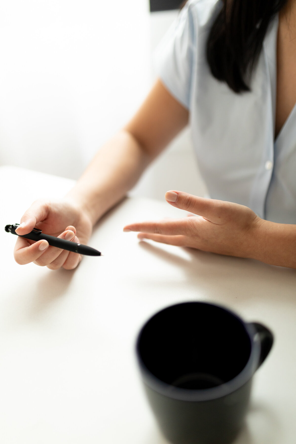 branding-detail-hands-pen-mug