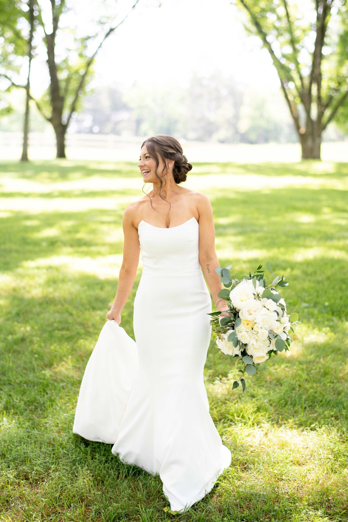 bride walking at marblegate farm