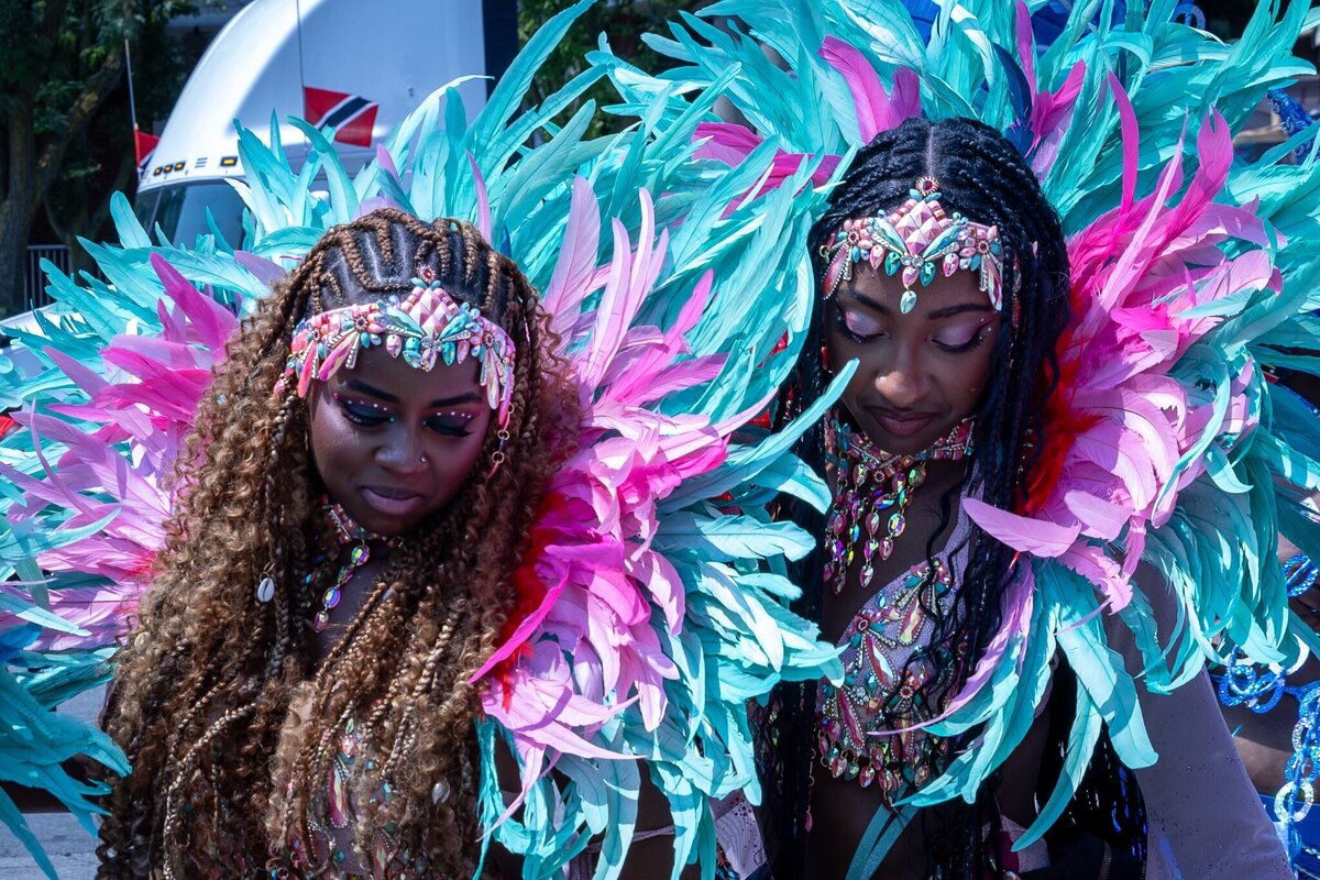 Toronto caribbean carnival parade masqueraders having fun in costume with Sunlime Mas, the number 1 medium size band at Toronto Carnival.
