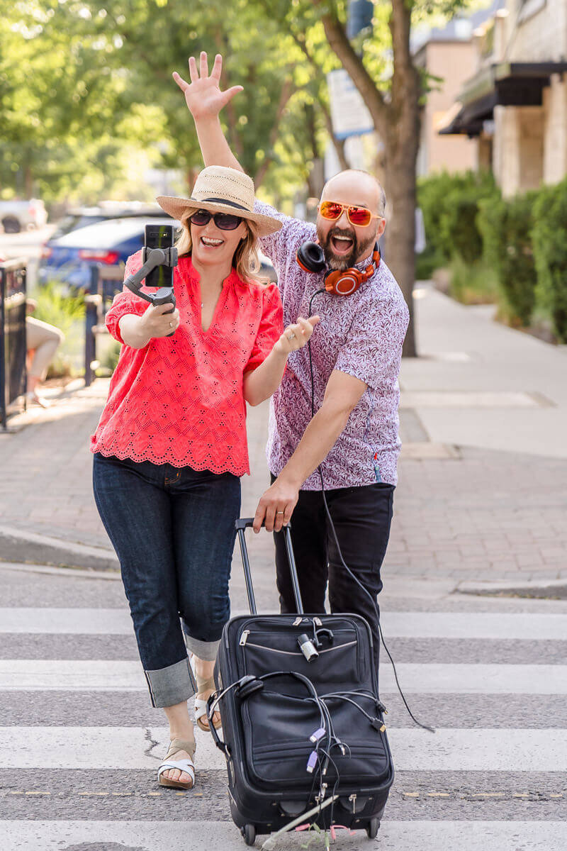 creative brand shoot of business partners in urban street leaving to go on vacation