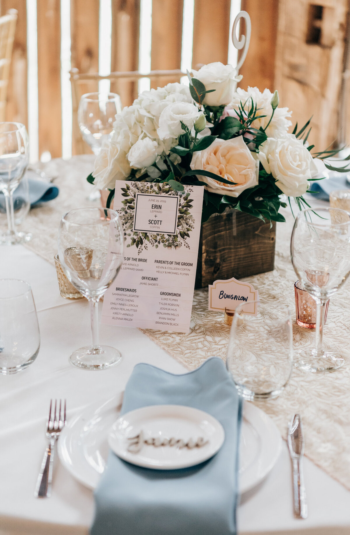 Eucalyptus themed wedding itinerary at luxurious barn wedding reception